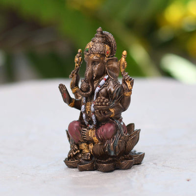 Handmade plastic Lord Ganesha idol, ideal for altar decor or as a gift. Dimensions: 7.9L x 4.8W x 4.8H cm, 180 grams.