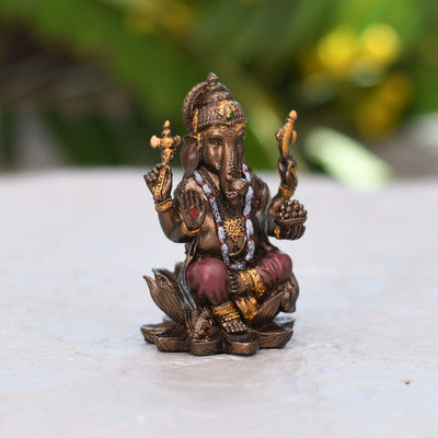 Handmade plastic Lord Ganesha idol, ideal for altar decor or as a gift. Dimensions: 7.9L x 4.8W x 4.8H cm, 180 grams.