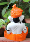 Handmade Playful Ganesha idol crafted from microfiber, measuring 11 x 10 x 25 cm, depicting Lord Ganesha playing the dholak