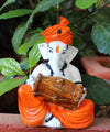 Handmade Playful Ganesha idol crafted from microfiber, measuring 11 x 10 x 25 cm, depicting Lord Ganesha playing the dholak