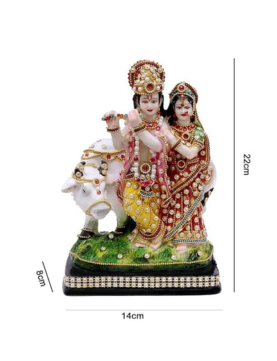 Handmade Radha Krishna cow idol made from durable polyresin, ideal for home decor, altars, and spiritual spaces.