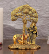 Handcrafted metal statue of Radha and Krishna under a Kadambh tree with a cow and calf, symbolizing divine love and traditional craftsmanship.
