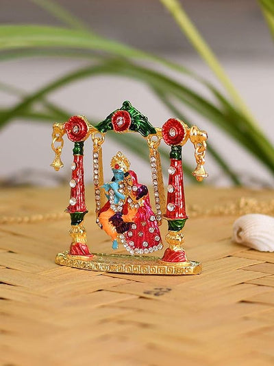 Handmade Radha Krishna metal idol depicting the divine couple on a swing, symbolizing love and harmony, ideal for home decor or altars.
