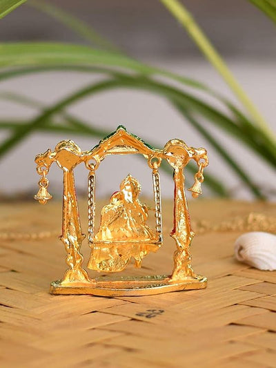 Handmade Radha Krishna metal idol depicting the divine couple on a swing, symbolizing love and harmony, ideal for home decor or altars.