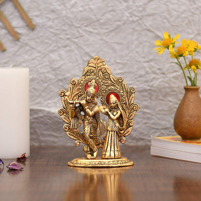 Handcrafted metal statue of Radha and Krishna playing the flute, measuring 11.4L x 5.1W x 17.8H cm, symbolizing love and devotion