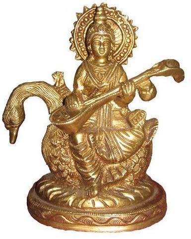 Handcrafted Astadhatu Saraswati idol in metal, intricately designed, depicting the goddess of knowledge and arts seated on a swan.
