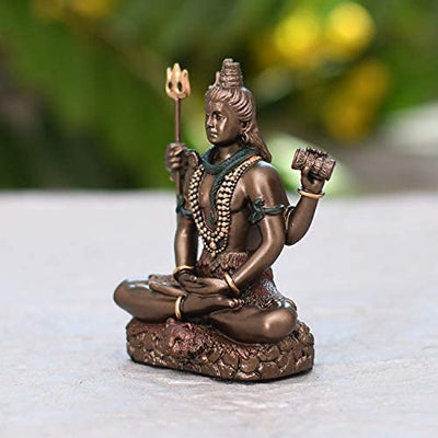 A compact resin idol of Lord Shiva in Padmasana pose, showcasing intricate details. Perfect for enhancing spiritual decor in any space.
