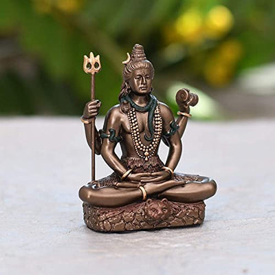 A compact resin idol of Lord Shiva in Padmasana pose, showcasing intricate details. Perfect for enhancing spiritual decor in any space.
