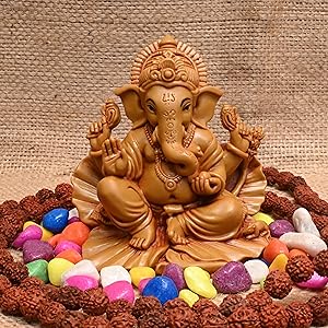 Handcrafted Shoeflower Ganesh idol in multicolored resin, symbolizing wisdom and prosperity, ideal for car dashboards and altar decoration.