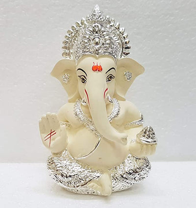 Handcrafted Silver Chandan Ganesha idol with intricate silver jewelry, symbolizing prosperity and wisdom, ideal for home decor and altars.