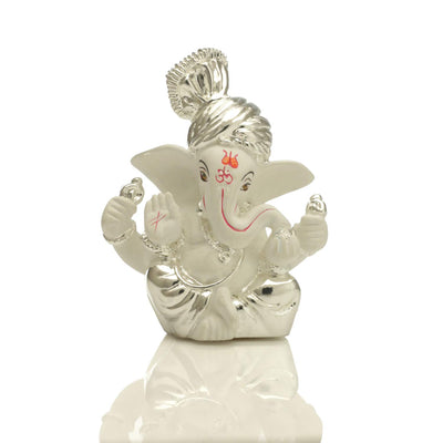 Handcrafted silver-plated Ganesha idol made of ceramic, symbolizing prosperity and blessings, ideal for home decor and altars.