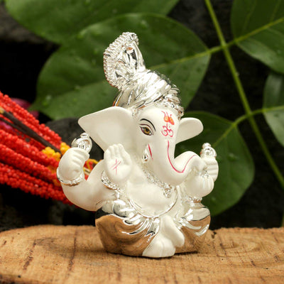 Handcrafted silver-plated Ganesha idol made of ceramic, symbolizing prosperity and blessings, ideal for home decor and altars.