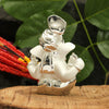Handcrafted silver-plated Ganesha idol made of ceramic, symbolizing prosperity and blessings, ideal for home decor and altars.