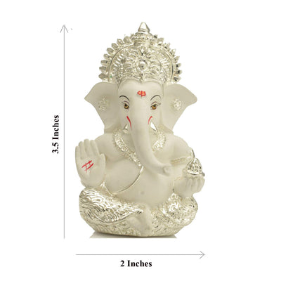 Handcrafted silver-plated Ganesha idol, symbolizing protection and good fortune, ideal for car interiors and altars.