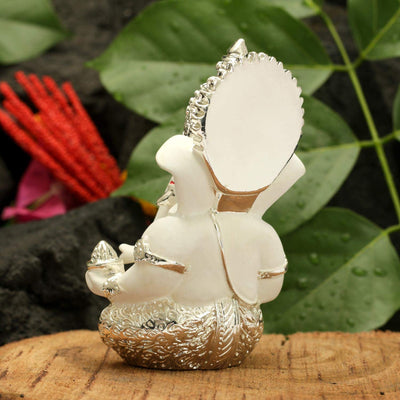Handcrafted silver-plated Ganesha idol, symbolizing protection and good fortune, ideal for car interiors and altars.