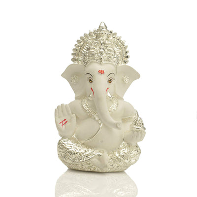 Handcrafted silver-plated Ganesha idol, symbolizing protection and good fortune, ideal for car interiors and altars.