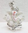 Handcrafted silver-plated Ganesha idol made of white terracotta, measuring 4L x 5W x 8.9H cm, perfect for home or car decor