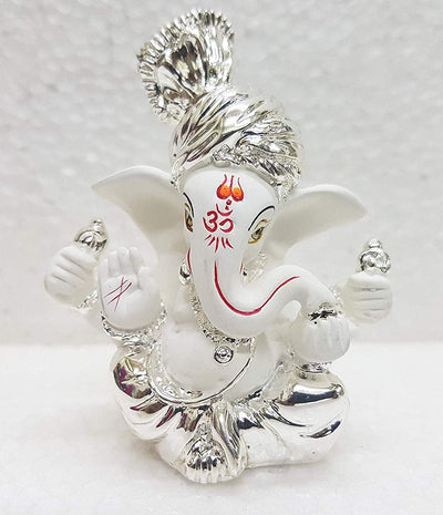 Handcrafted silver-plated Ganesha idol made of white terracotta, measuring 4L x 5W x 8.9H cm, perfect for home or car decor
