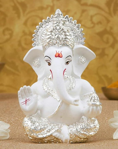 Handmade silver-plated Lord Ganesha idol, measuring 5.1 x 5.1 x 8.9 cm, featuring intricate terracotta details and lifelike eyes