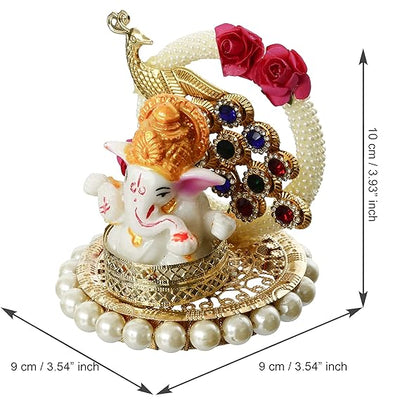 A small golden idol of Lord Ganesha, the Hindu god of wisdom and remover of obstacles, suitable for home decor.