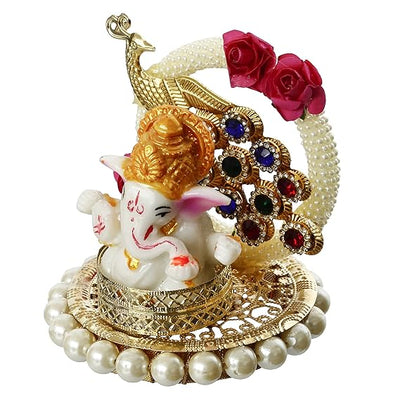 A small golden idol of Lord Ganesha, the Hindu god of wisdom and remover of obstacles, suitable for home decor.