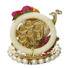 A small golden idol of Lord Ganesha, the Hindu god of wisdom and remover of obstacles, suitable for home decor.