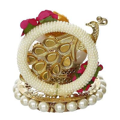 A small golden idol of Lord Ganesha, the Hindu god of wisdom and remover of obstacles, suitable for home decor.